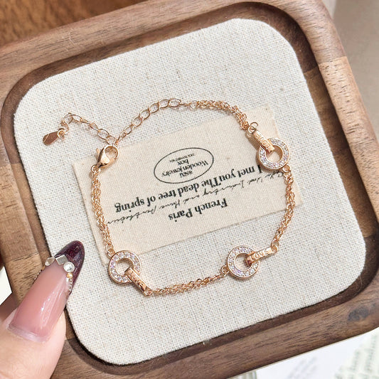 Diamond-studded copper coin bracelet