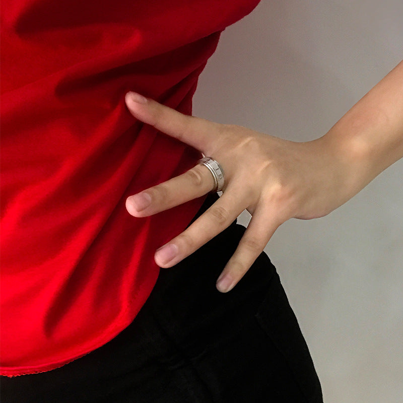 Rotatable Roman titanium and steel ring